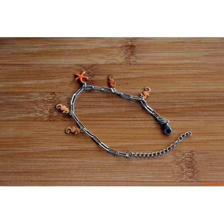 Bracelet de breloques hippocampes et étoile de mer oranges