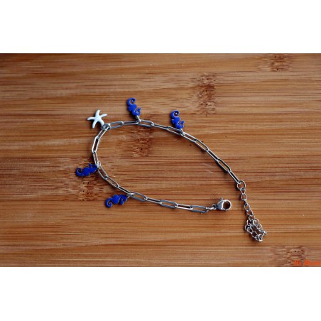 Bracelet de breloques hippocampes bleus électriques et étoile de mer blanche