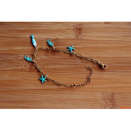 Bracelet de breloques hippocampes et étoile de mer turquoises